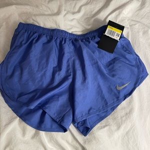Blue Nike running shorts